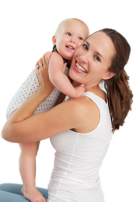 Young mother with smiling baby in her lap